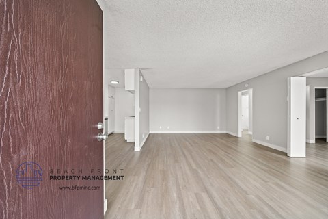 the renovated living room and dining room of an apartment