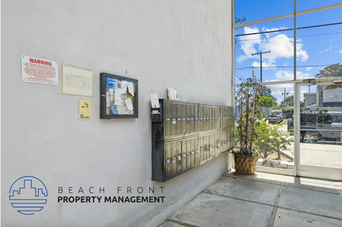 the entrance to the beach front property management office at the front of the building