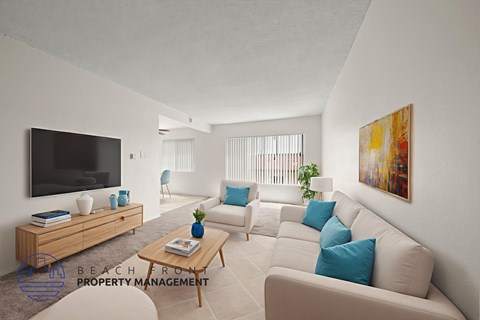 A living room with a television, sofas, and a coffee table.