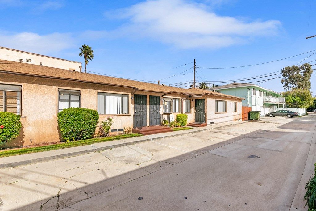 a row of houses on the side of a street