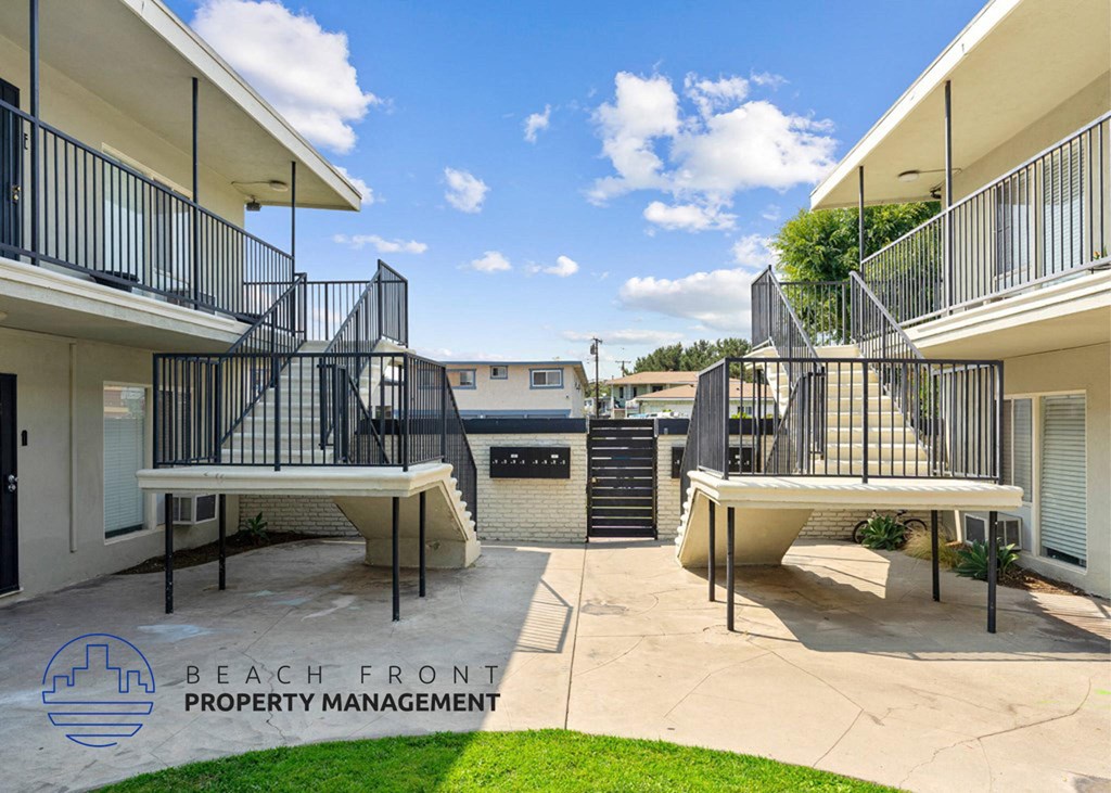 a patio with two decks and a grill