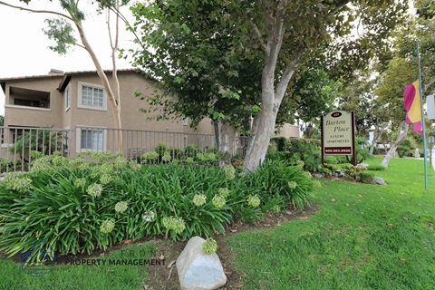 A sign for Barton Place is in front of a building.