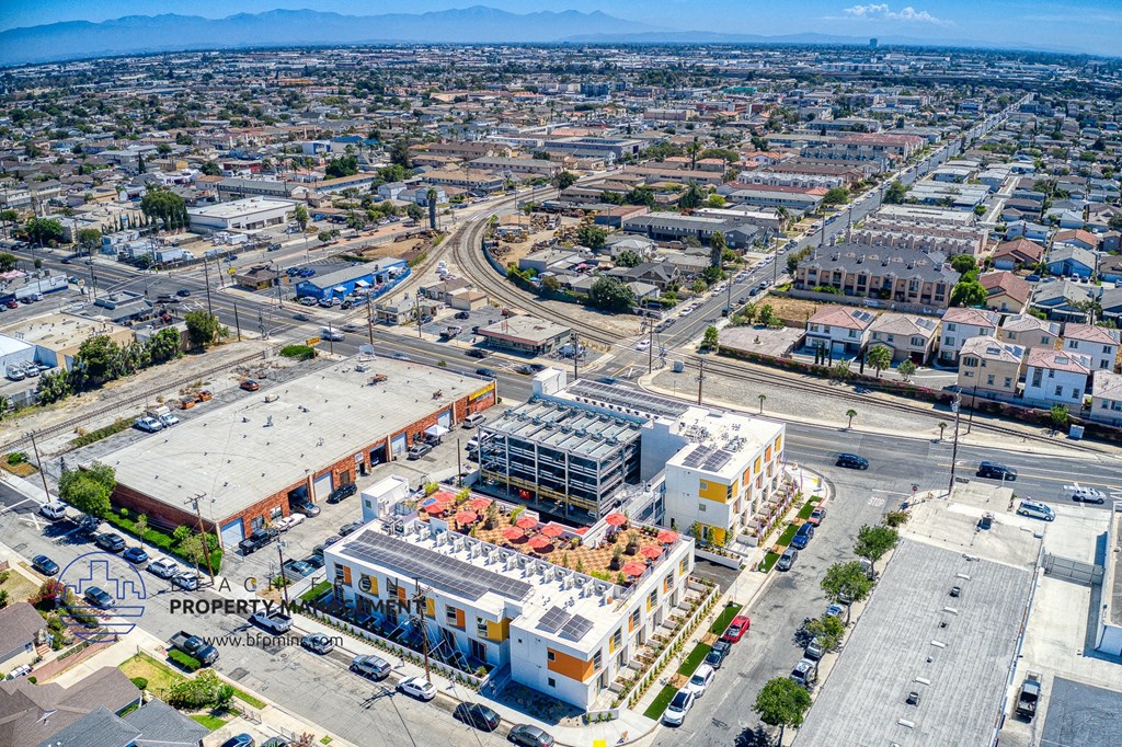 an aerial view of a city with buildings and cars