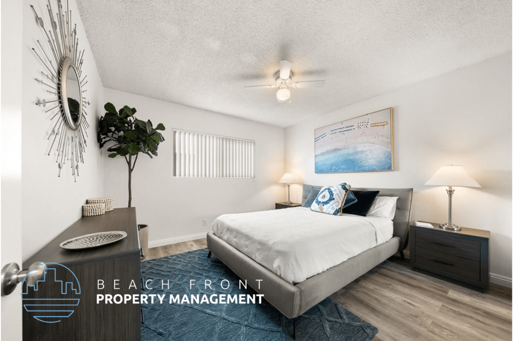 a bedroom with a bed and a ceiling fan