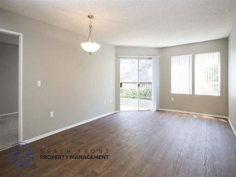 a view of the living room and dining room of an open floor plan
