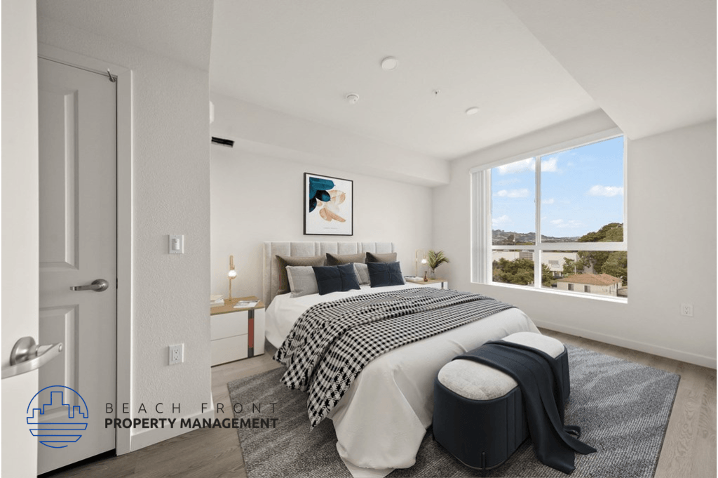 a white bedroom with a bed and a window