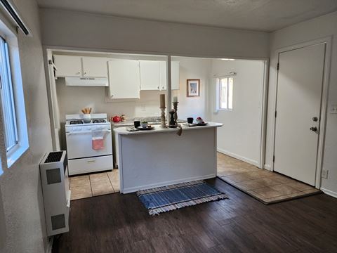 a view of a kitchen from the living room