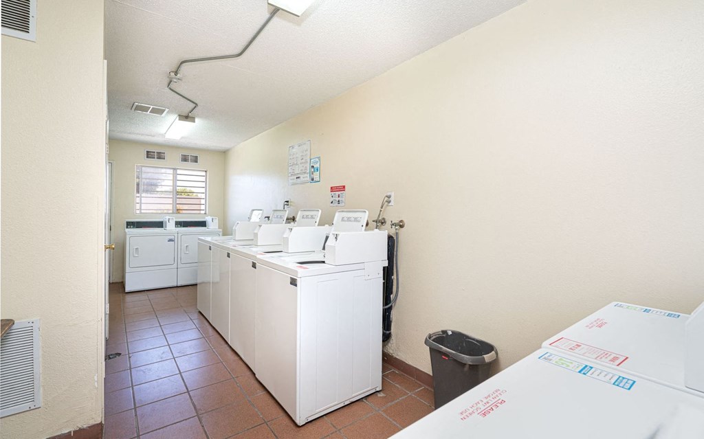 laundry room with washers and dryers