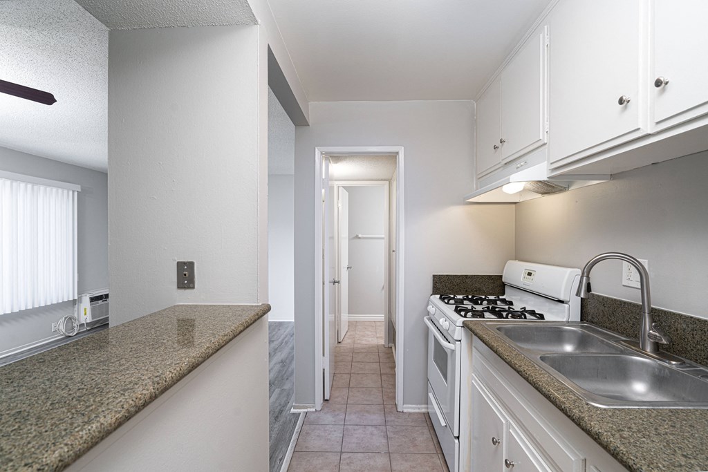 kitchen with white cabinets and granite countertops