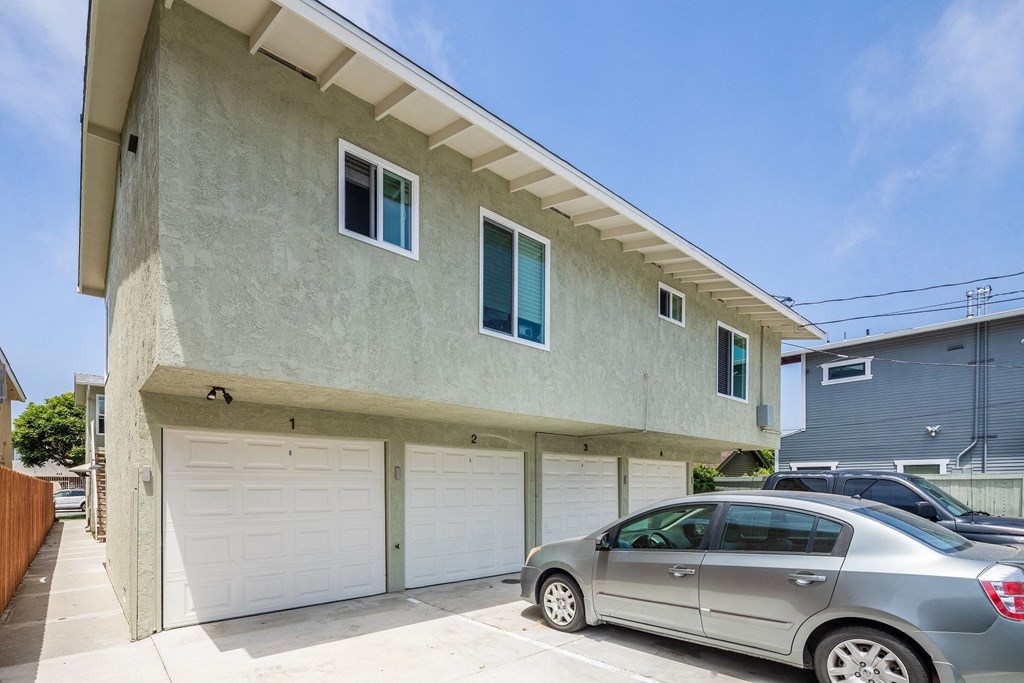 a car parked in a driveway in front of a building