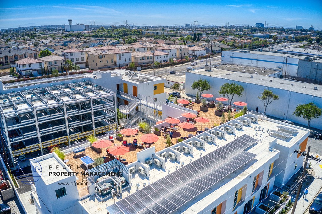 elevated view of the roof of a building with terraces and a rooftop garden