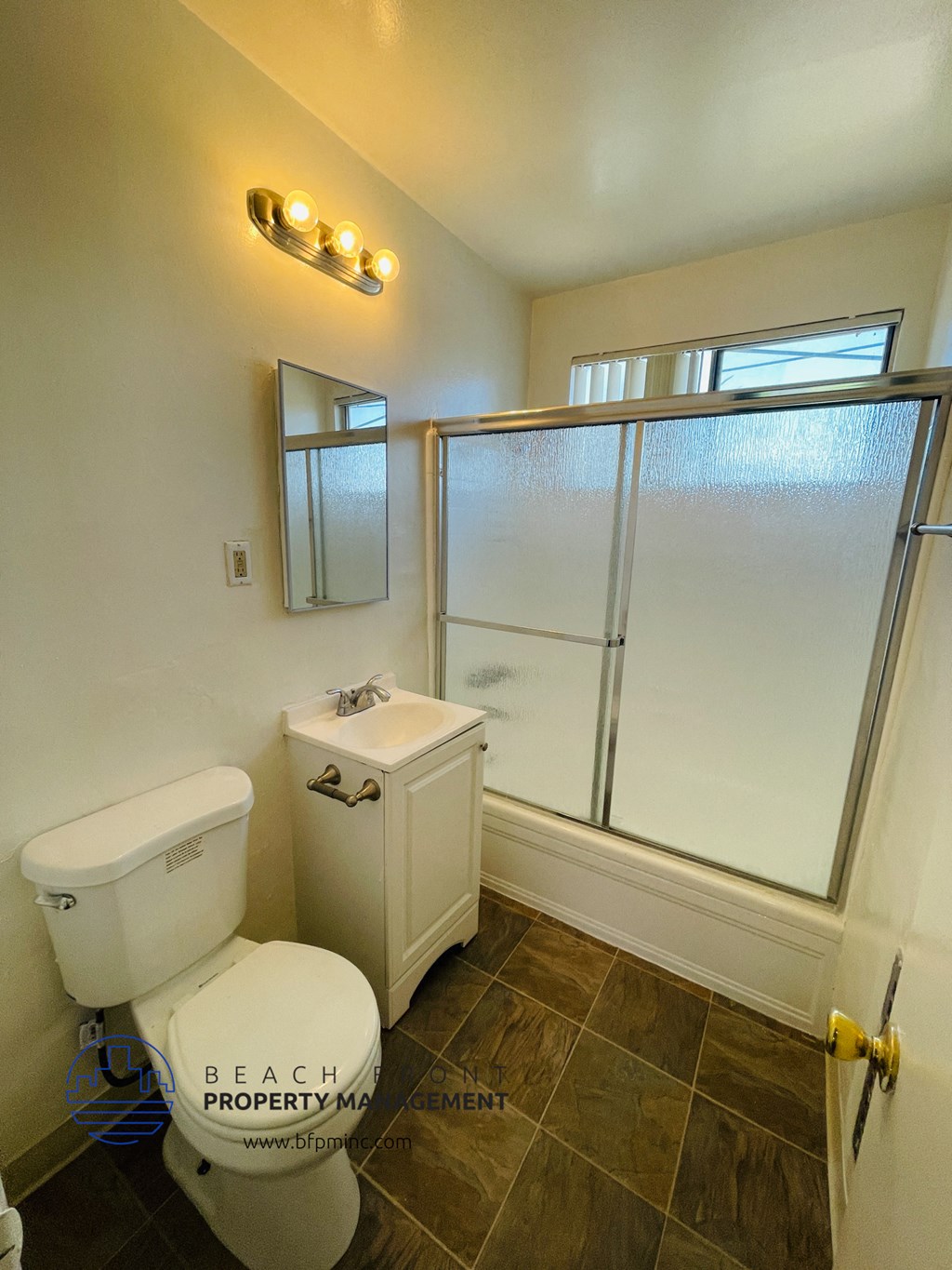 a small bathroom with a toilet and a shower