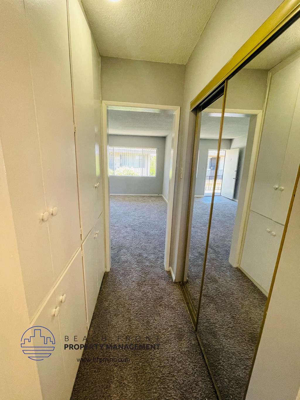 a mirror in the middle of a closet in a bedroom