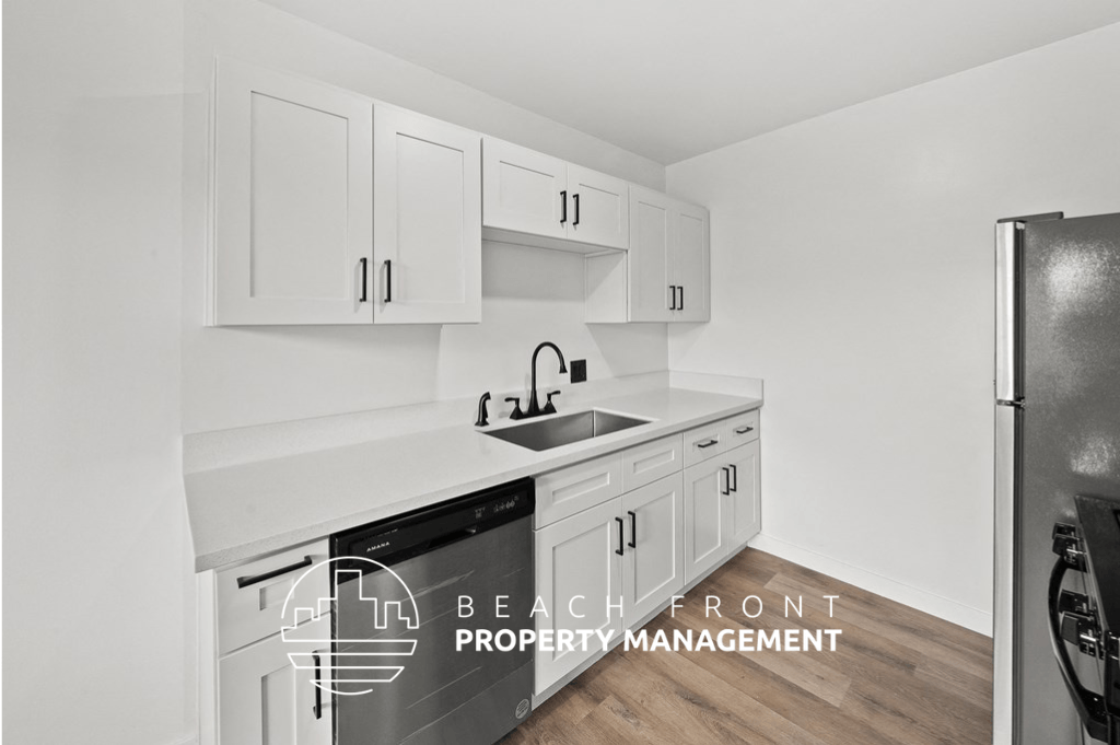 a curved wall of white cabinets with rainbow colored lights