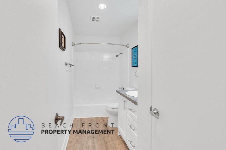 a bathroom with a shower and a sink and a toilet