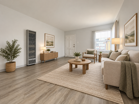 A living room with a couch, chair, and table.
