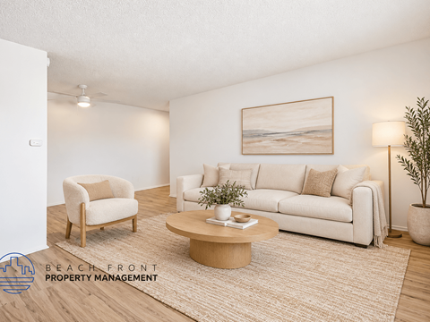 A living room with a couch, chair, and coffee table.