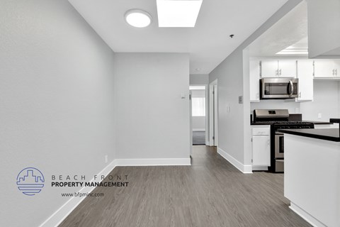 A kitchen area with a counter and a microwave.