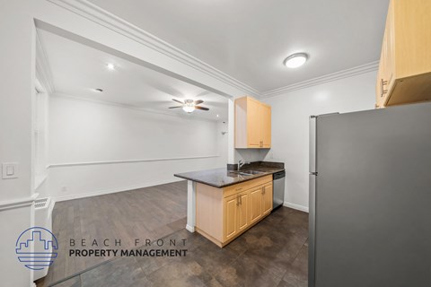 a kitchen with a counter top and a refrigerator