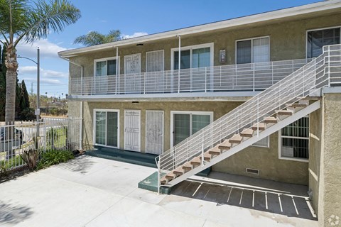 A building with a staircase leading to the second floor.
