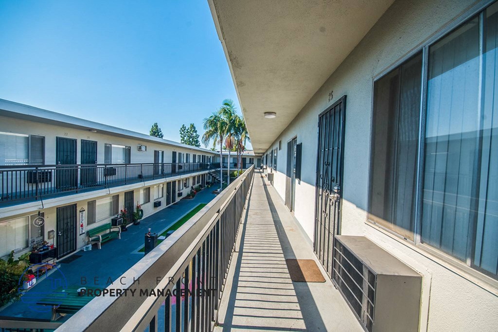 a view of the balcony of a large apartment building