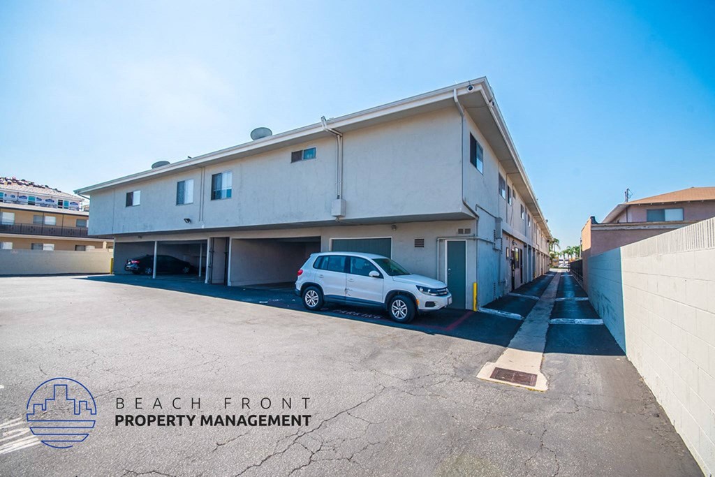 a white building with a white car parked in front of it