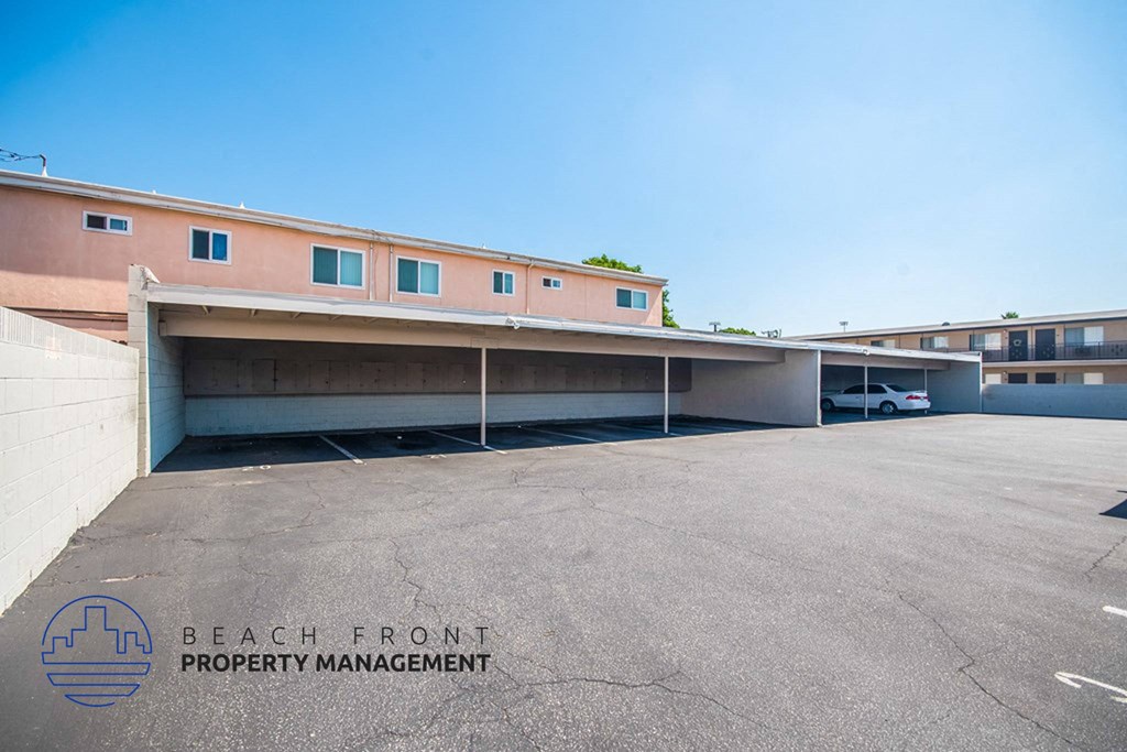 an empty parking lot in front of a building