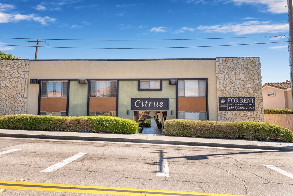 a building with a sign that reads clinics on the side of a street