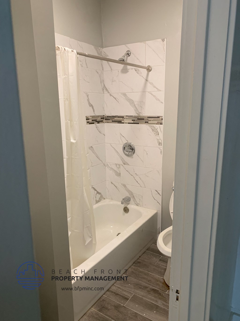 a small bathroom with a shower and a toilet