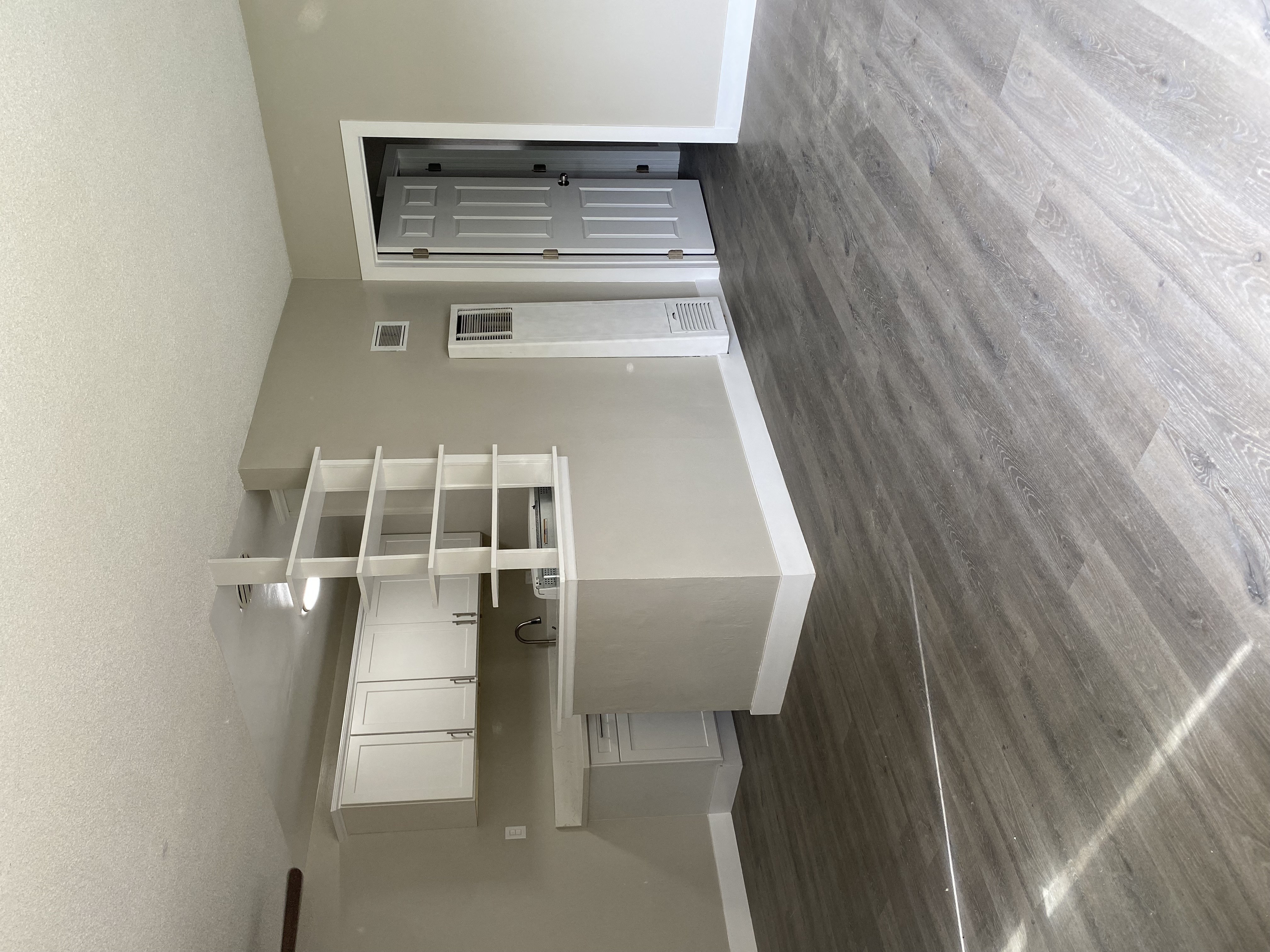 an overhead view of a room with a desk and a closet