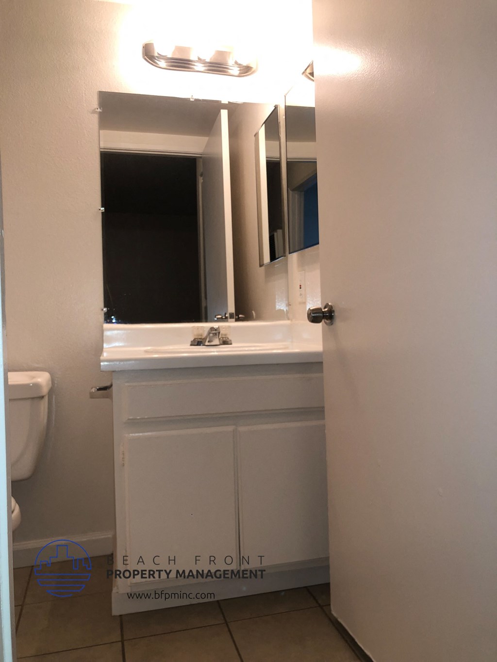 a bathroom with a sink and a mirror and a toilet