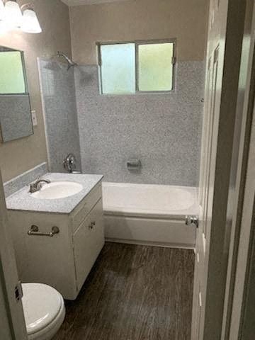 a bathroom with a sink toilet and a bath tub