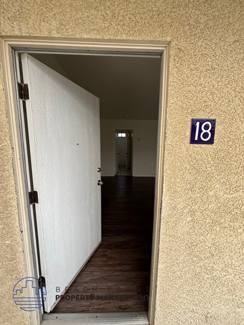 A door with a number 18 on the wall behind it.
