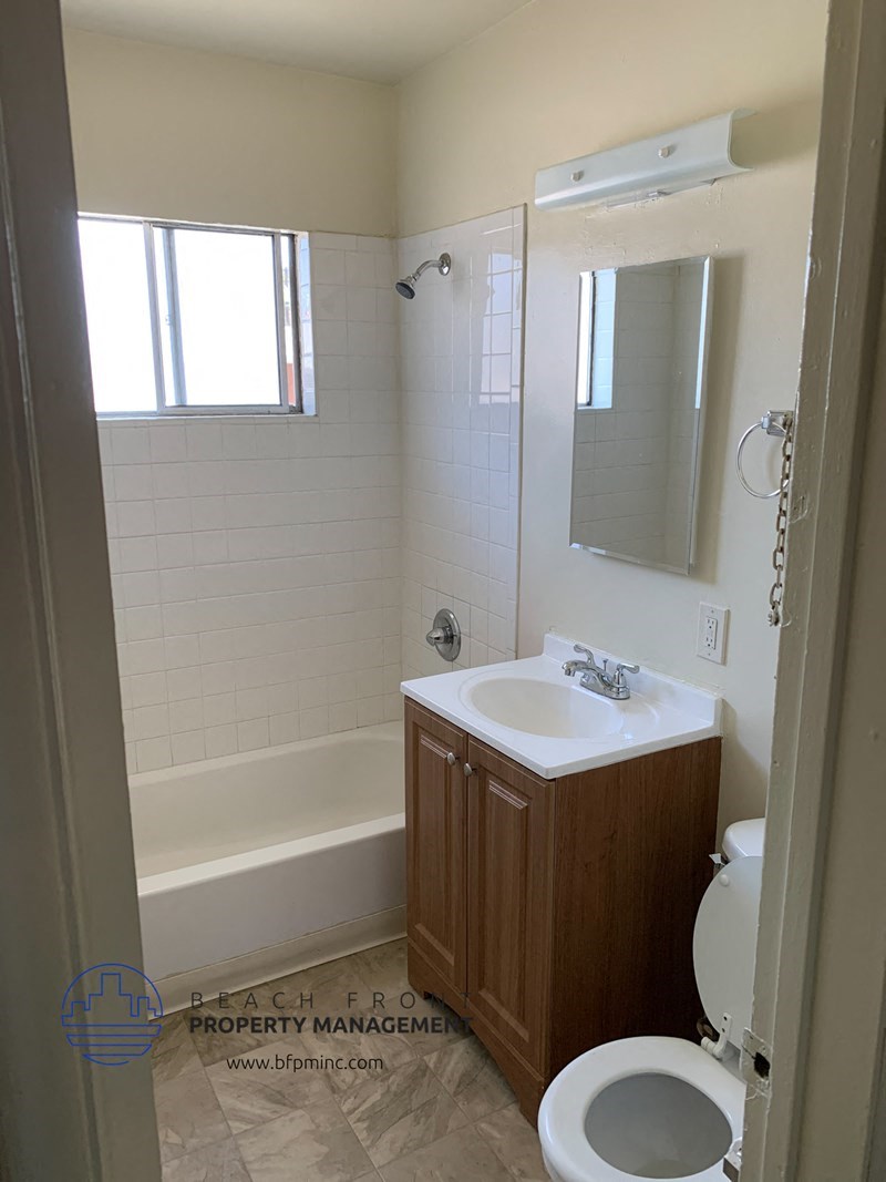 a bathroom with a sink toilet and a bath tub