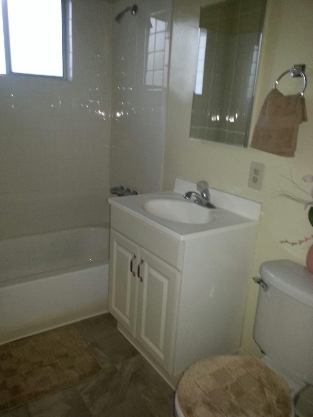 a bathroom with a sink and a toilet and a tub