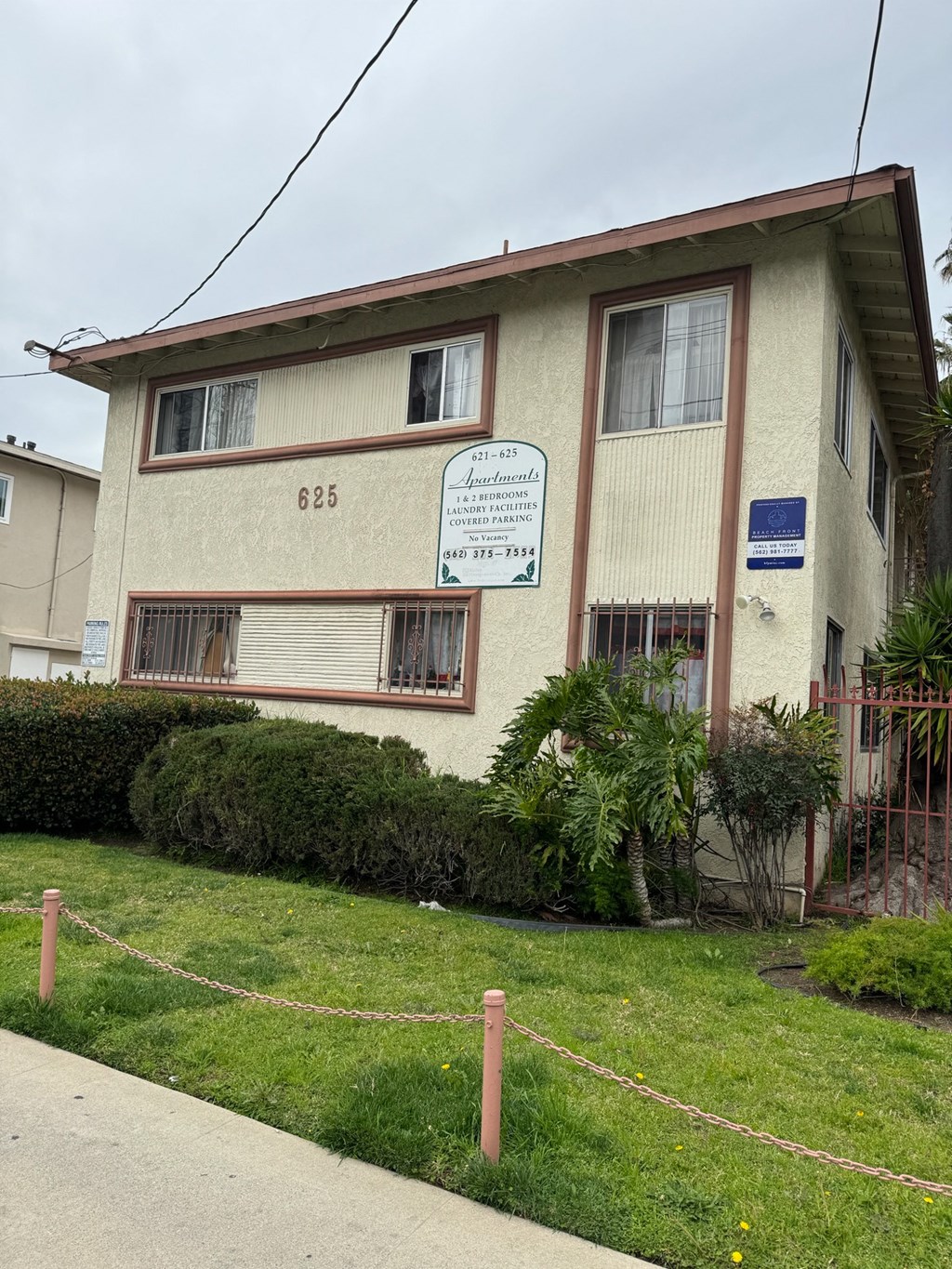 an apartment building with a sign on the side of it