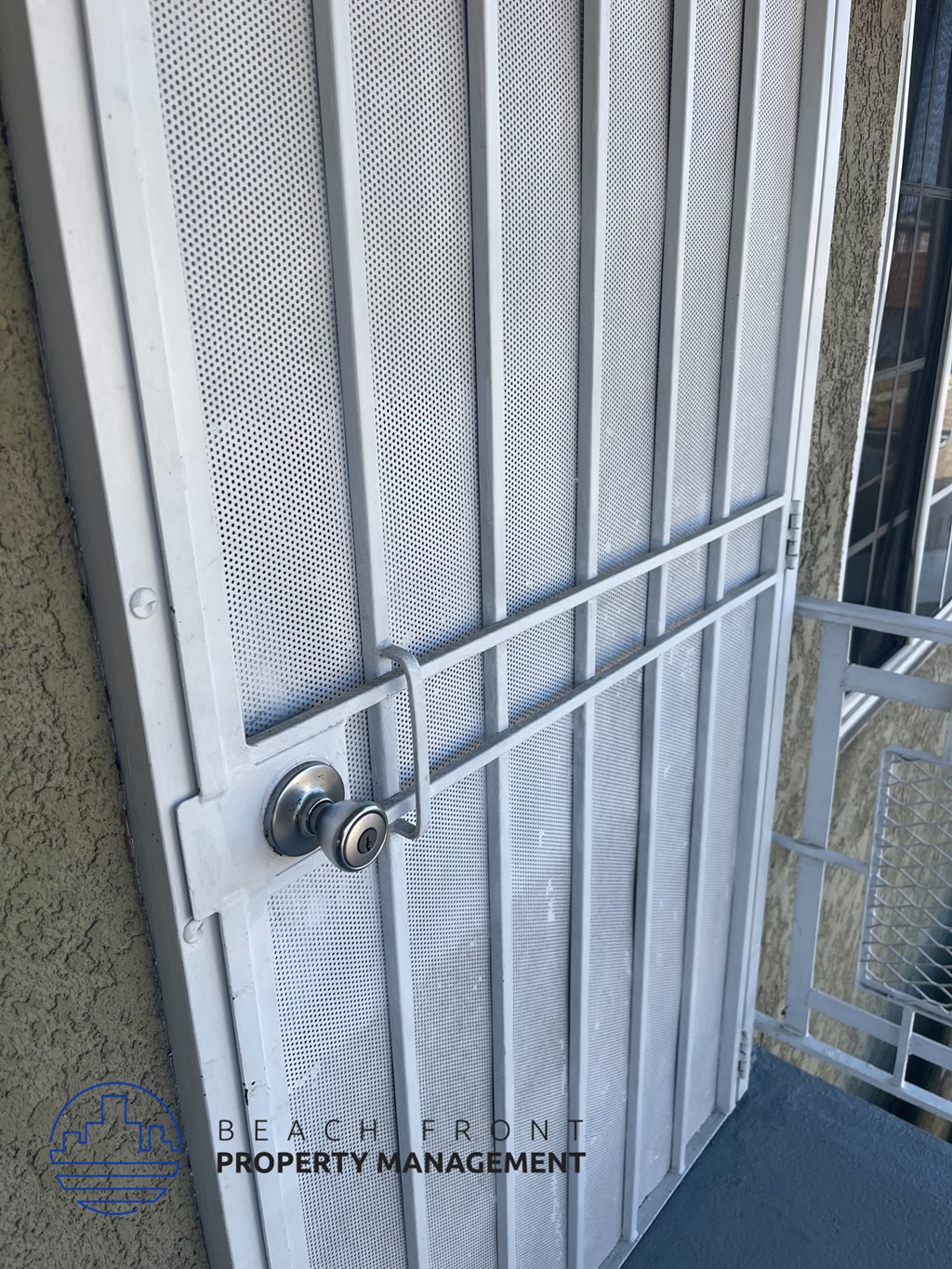 the door of a prison cell with a lock on it