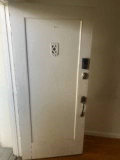 a white door in a room with a door handle