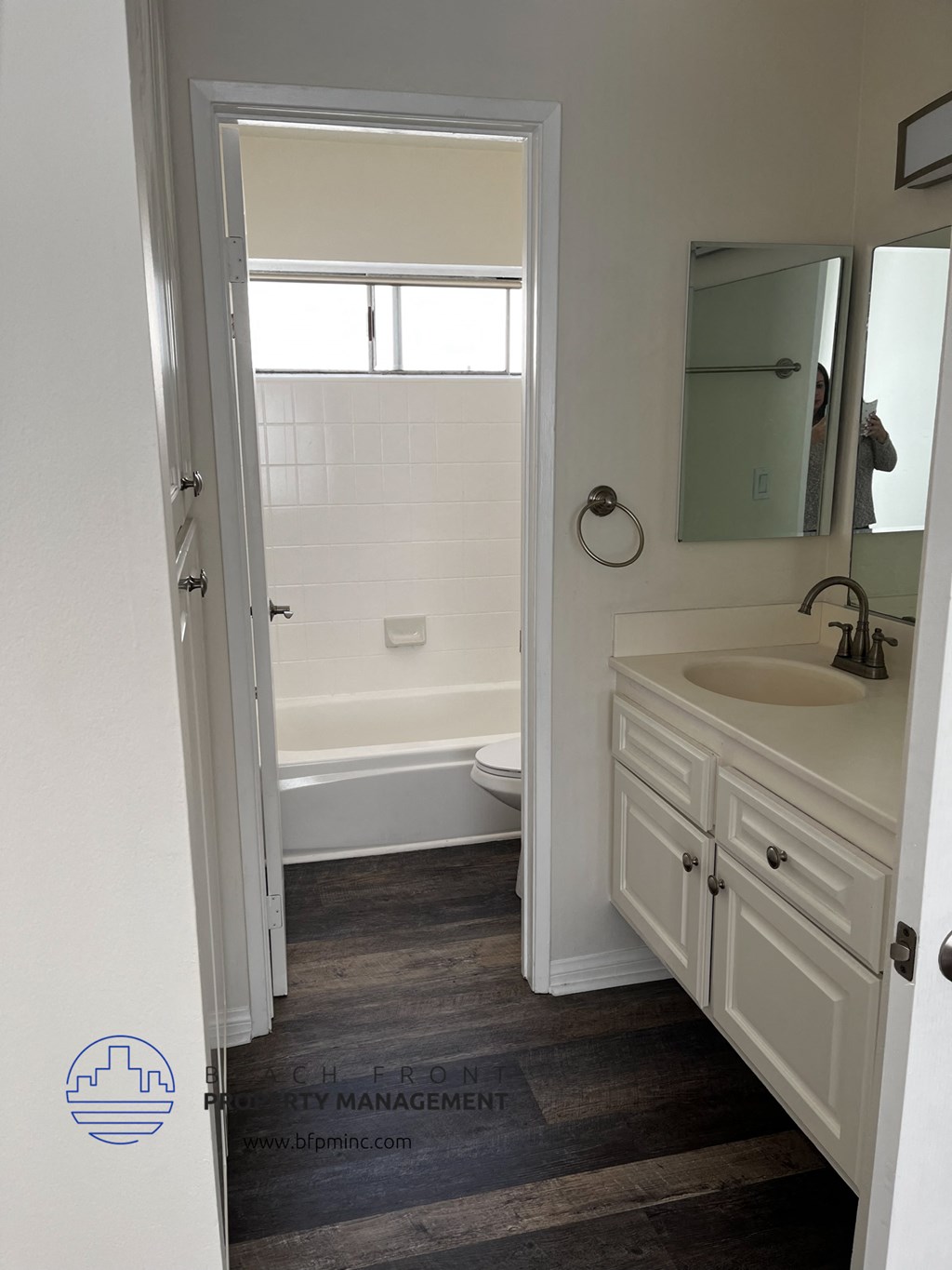 a bathroom with a sink and a toilet and a bath tub