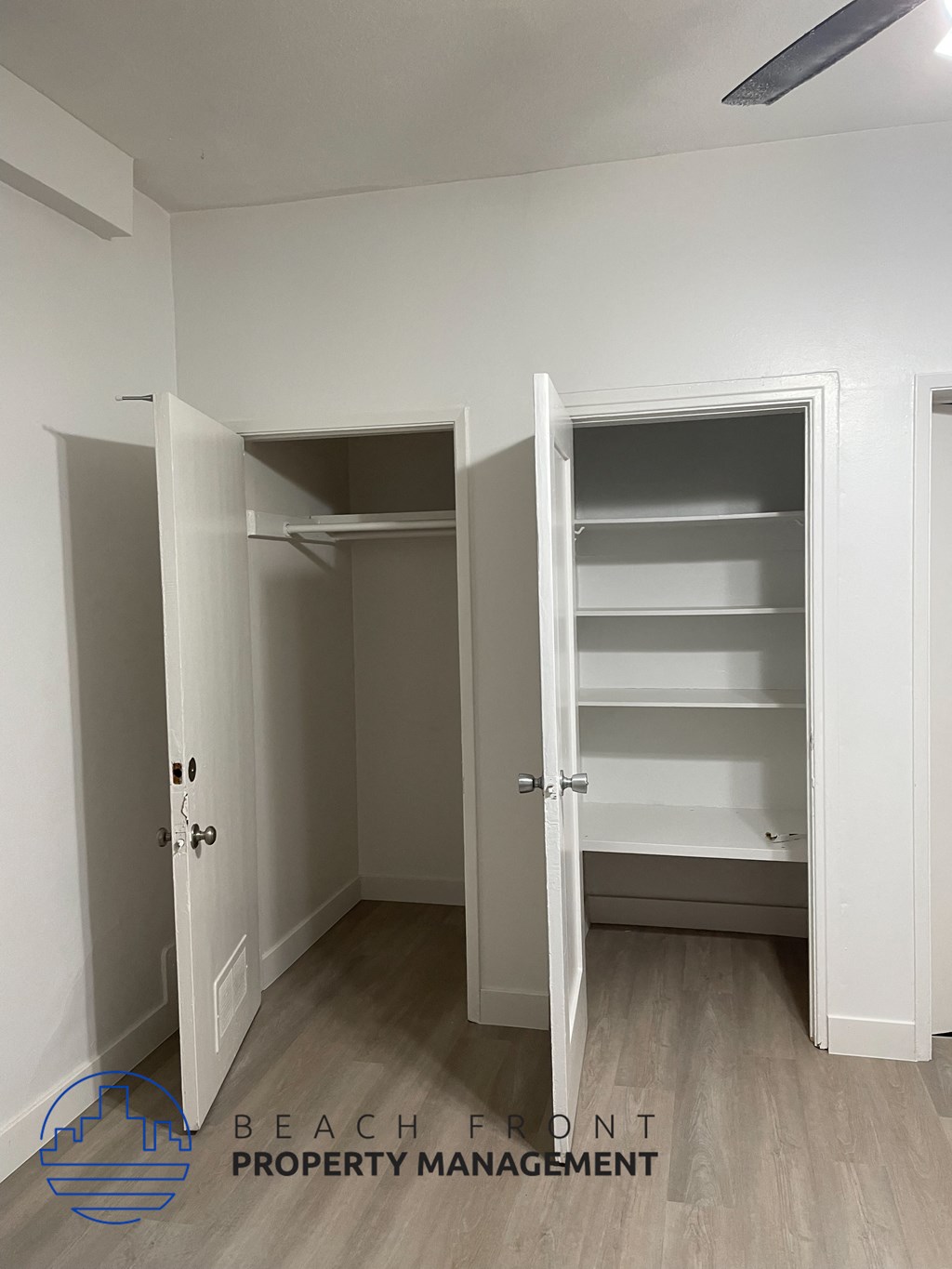 a bedroom with a closet and an open door to a closet