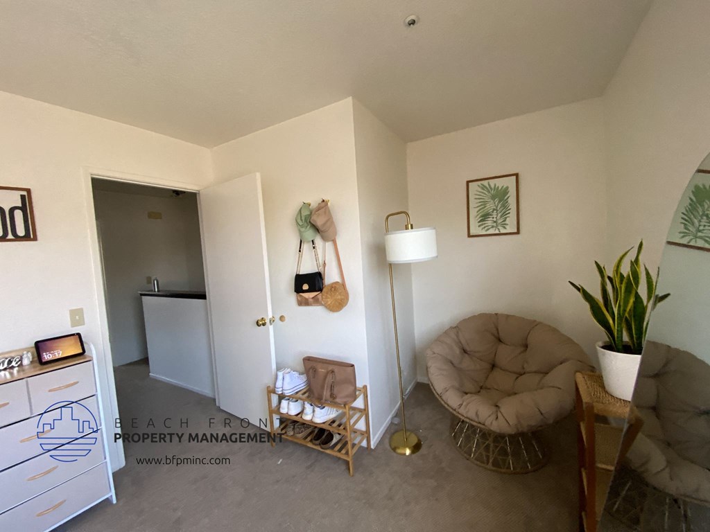 the living room and kitchen of a small apartment