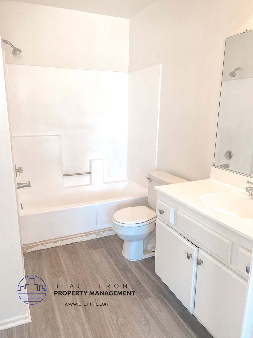 an empty bathroom with a toilet and a sink