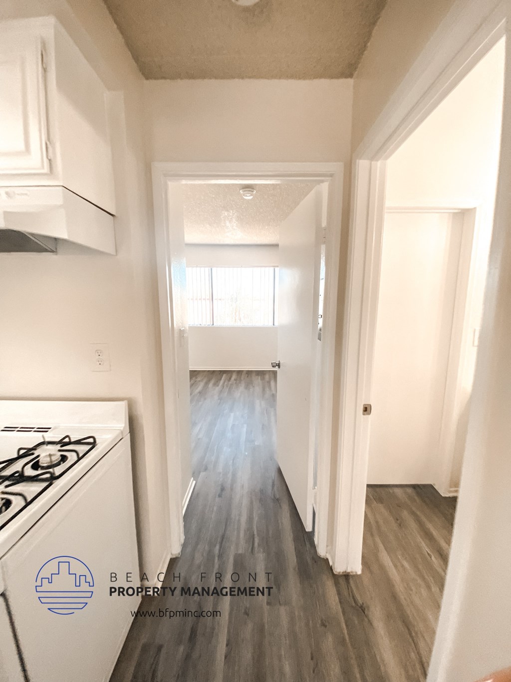 the view from the kitchen into the living room in a 555 waverly unit