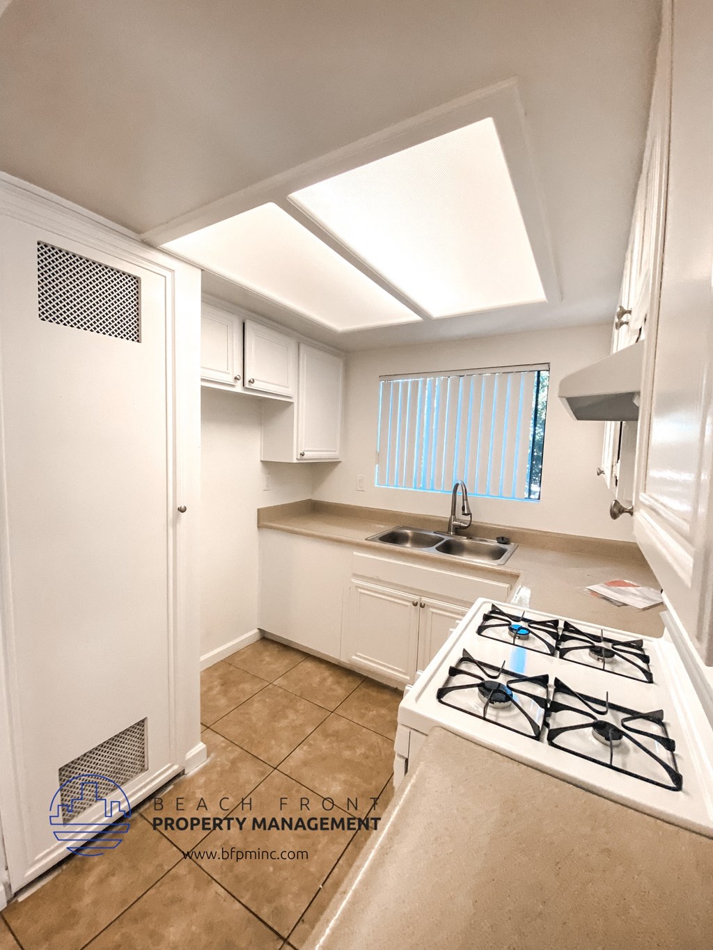 a small kitchen with a stove and a sink