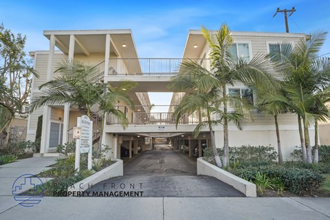 A beachfront property with a sign for Beachfront Property Management.