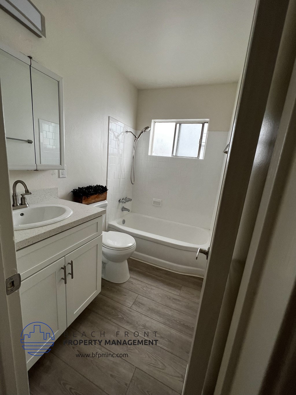 a small bathroom with a sink toilet and bathtub