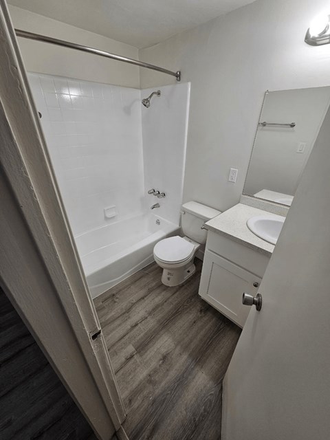 a bathroom with a toilet sink and bathtub
