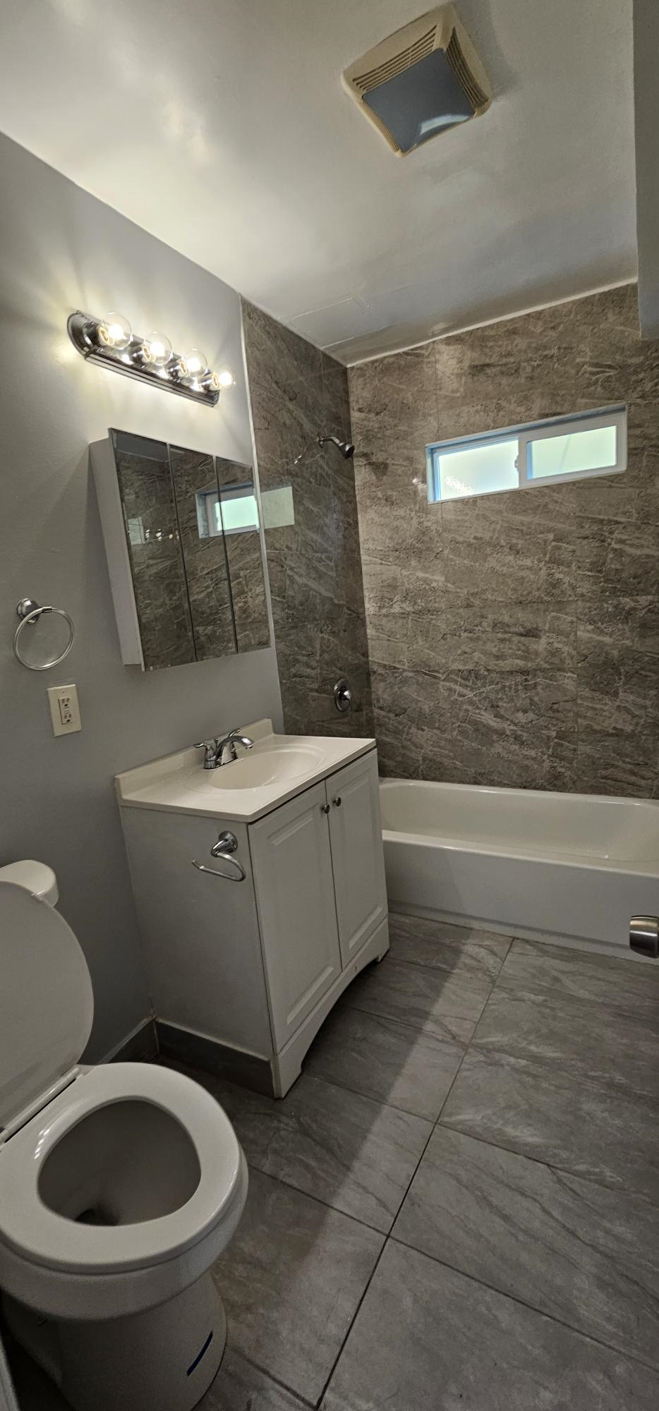 a bathroom with a toilet and a sink