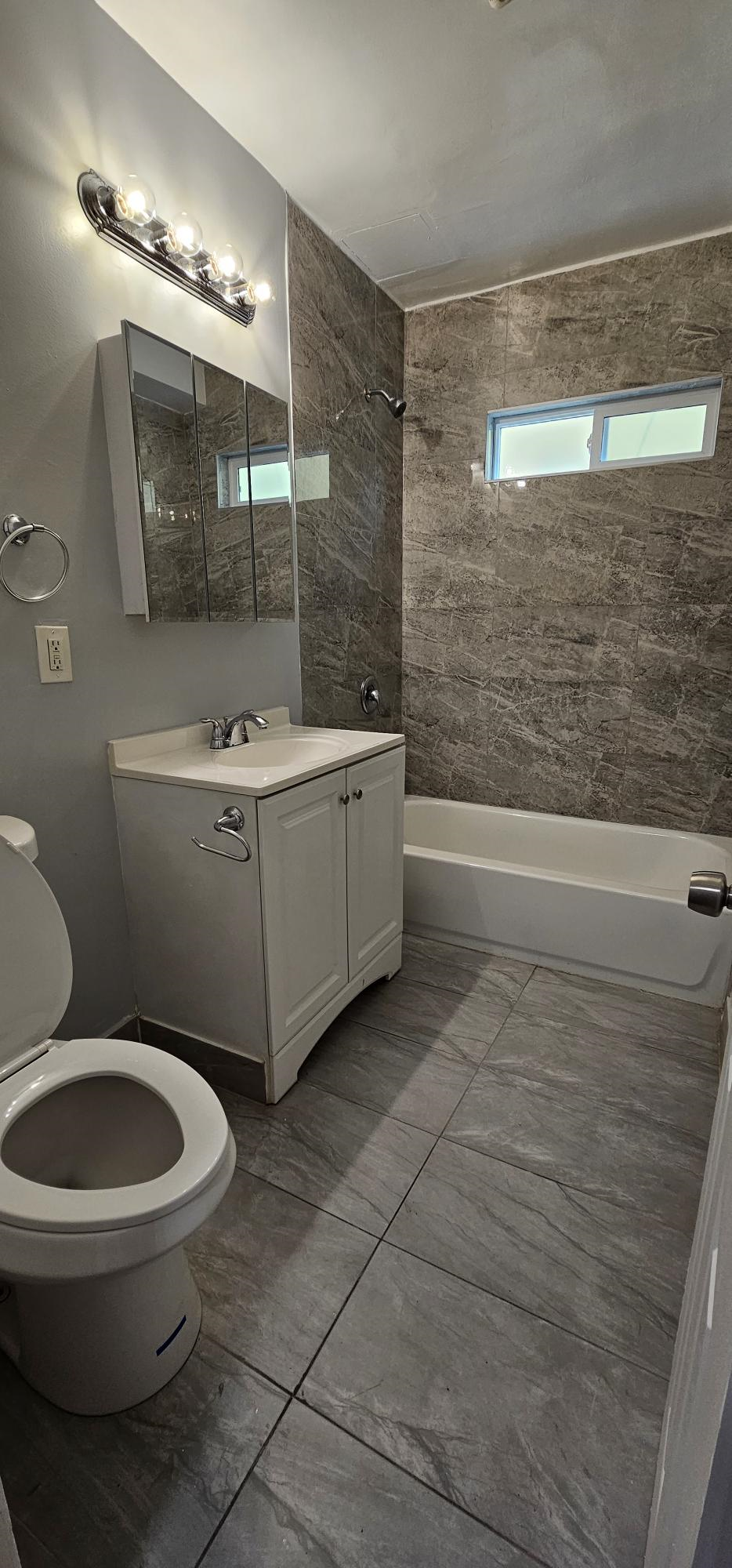 a bathroom with a toilet and a sink