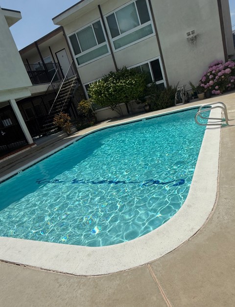 A small pool with a ladder in the middle.